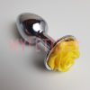 Gebruikte buttplug met geel roosje